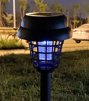 Solar mosquito killer lamp with white light and purple insecticidal glow for outdoor use