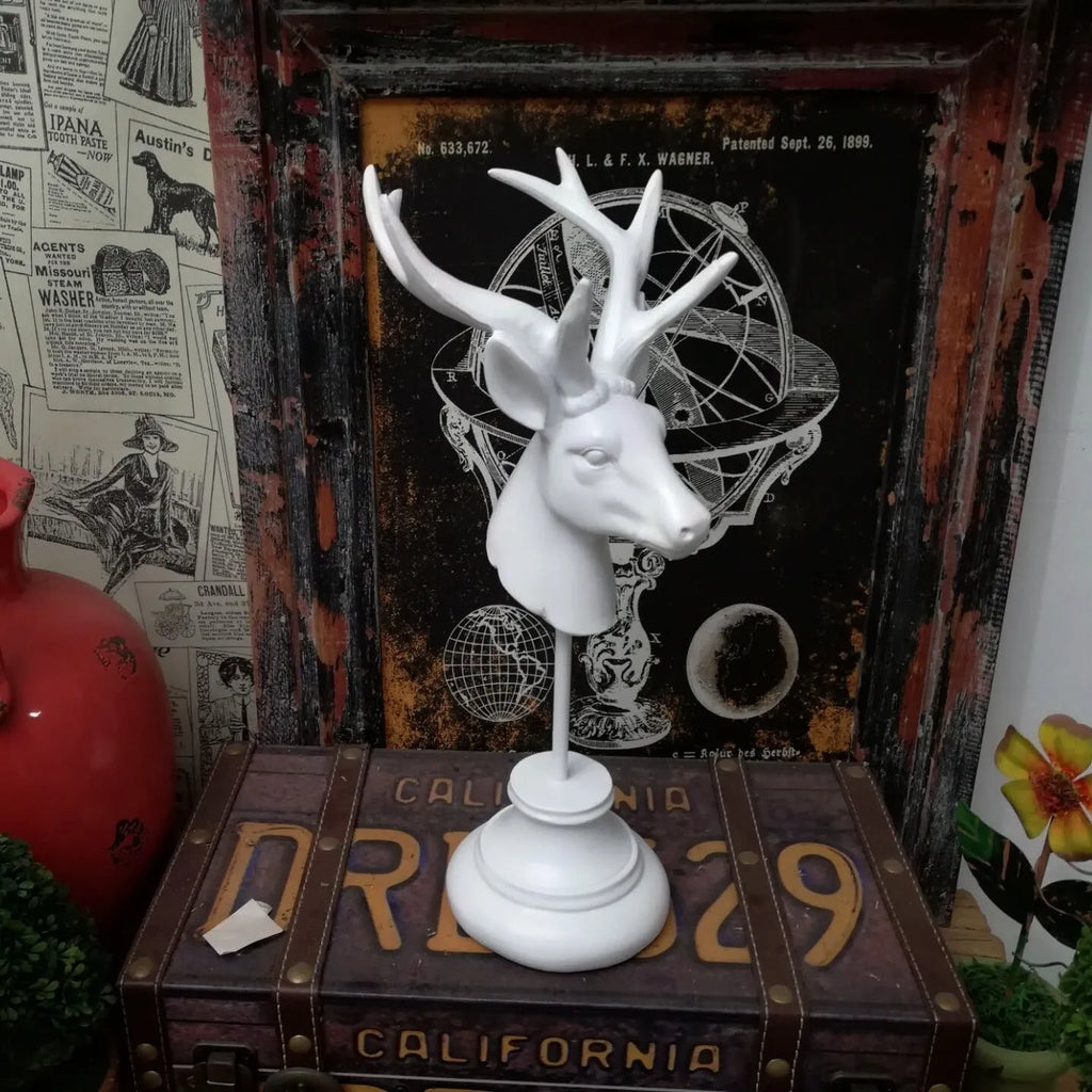 A tall resin animal sculpture home decoration in black, white, or wood colour finish.