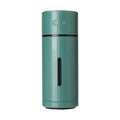 White USB small car desktop humidifier with adjustable angle nozzle and colourful night light on a desk