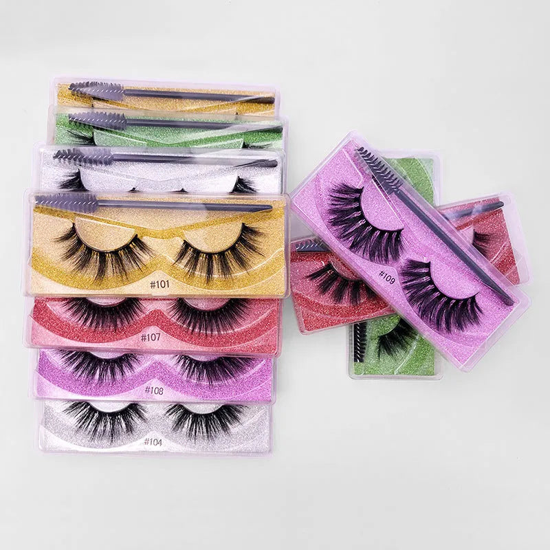 Pair of natural 3D imitation mink false eyelashes with brush in elongated eye-tail style