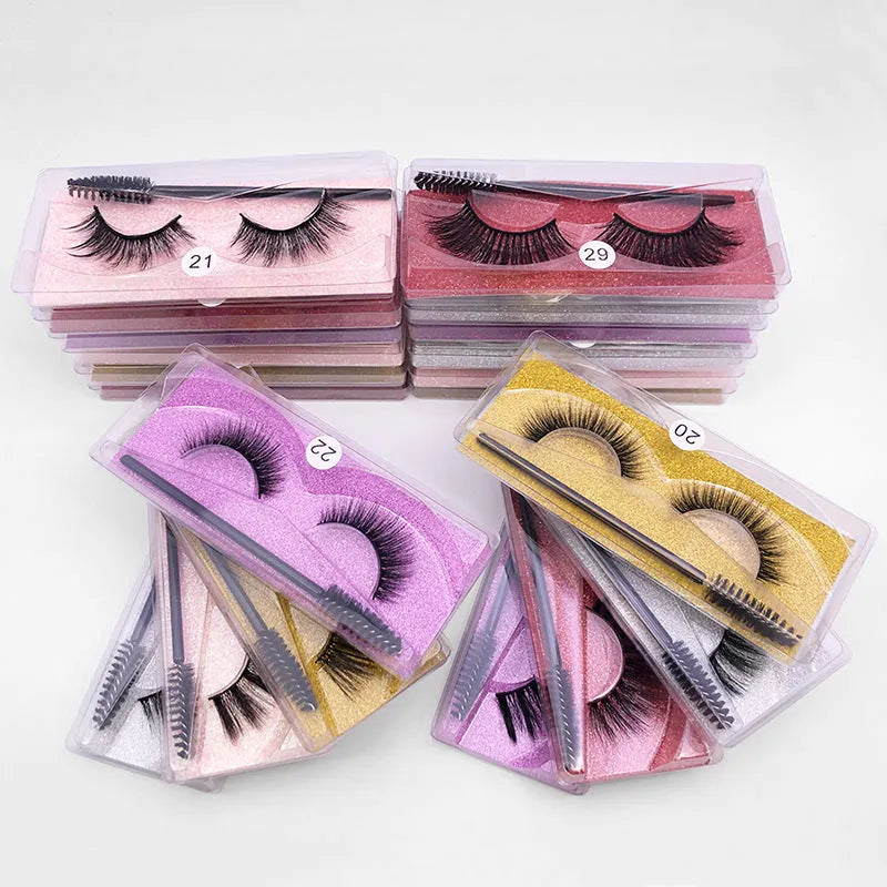 Pair of natural 3D imitation mink false eyelashes with brush in elongated eye-tail style