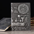 Retro embossed A5 notebook in green bronze, showing textured leather cover and open, lay-flat pages.