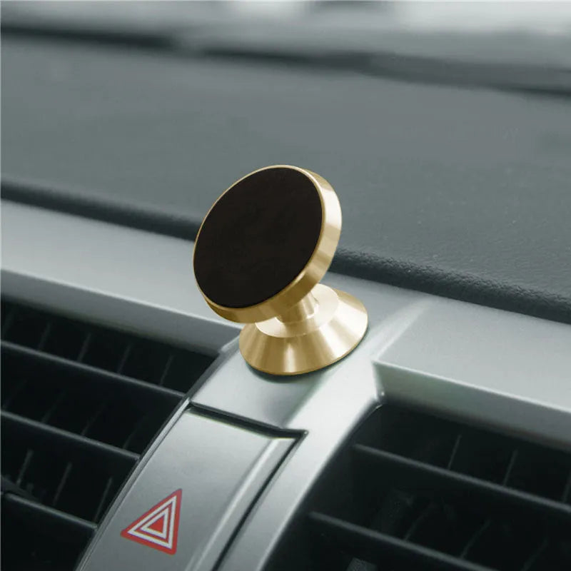 Universal magnetic car phone holder in black, compact size for dashboard or vent mounting