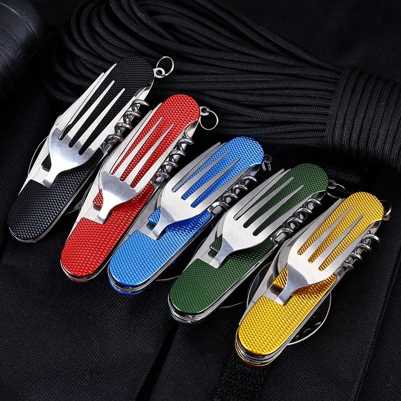 Multifunctional stainless steel outdoor camping knife fork spoon set folded and unfolded on a wooden table