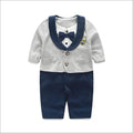 Baby boy wearing cotton jumpsuit in gentleman style with long sleeves for spring or autumn