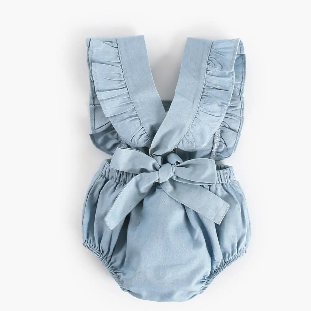 Blue denim sleeveless baby romper with princess styling and triangle climb closure