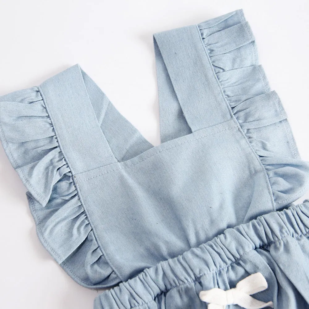 Blue denim sleeveless baby romper with princess styling and triangle climb closure