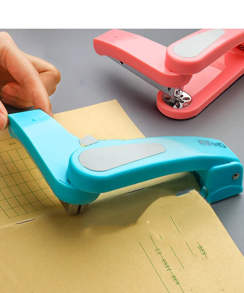 360-degree rotatable desktop stapler in dark blue, shown binding sheets of A4 paper.