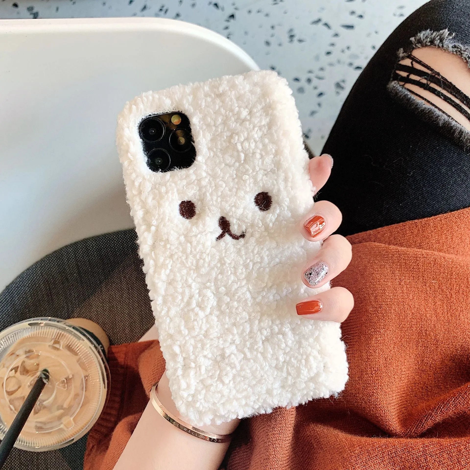 Embroidery plush bear face design on a flexible brown TPU phone case for iPhone