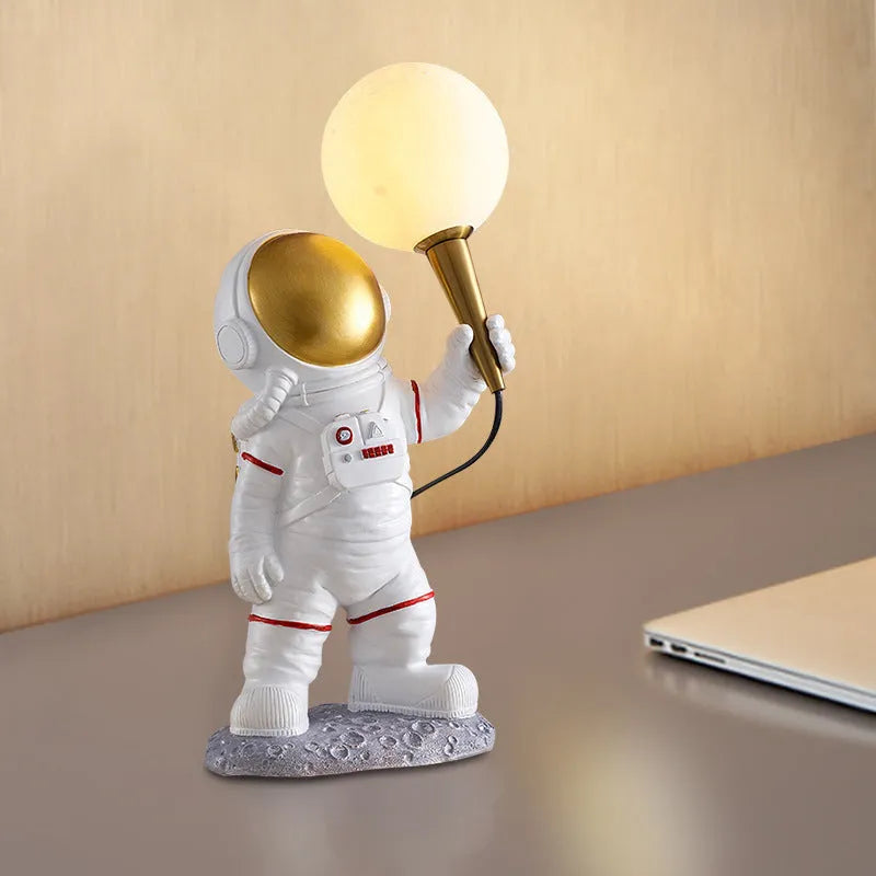 White astronaut desk lamp shown in standing, seated, and wall-mounted configurations