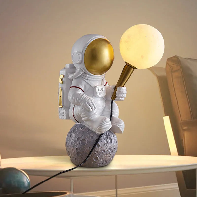White astronaut desk lamp shown in standing, seated, and wall-mounted configurations