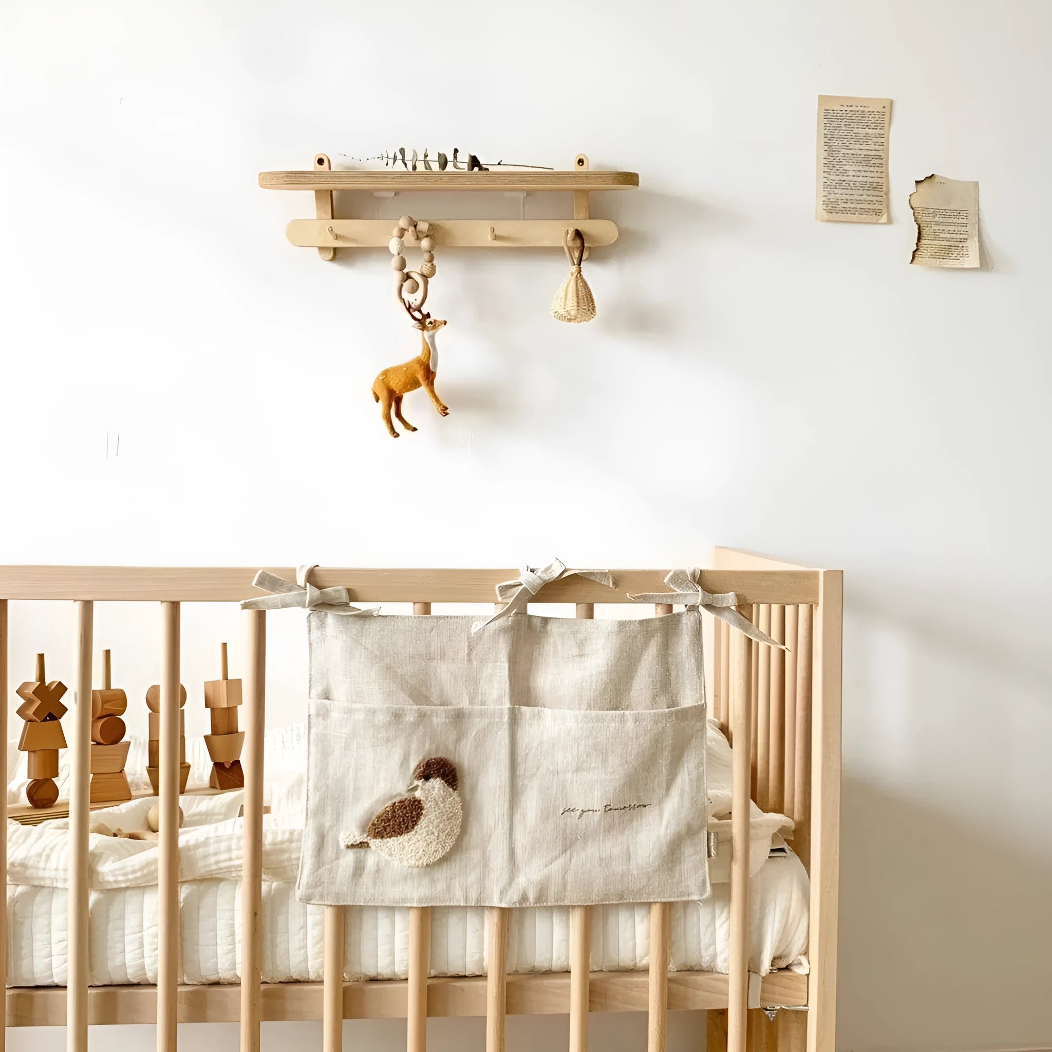 Khaki coloured cotton linen hanging storage bag with one pocket, designed for bedside organisation.