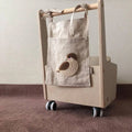 Khaki coloured cotton linen hanging storage bag with one pocket, designed for bedside organisation.