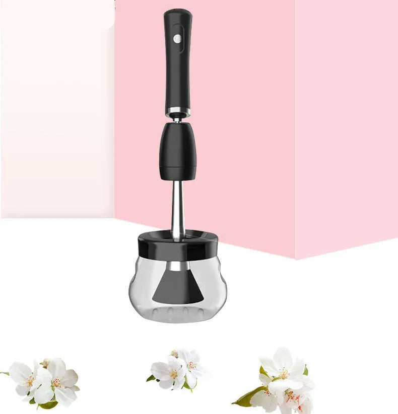 Black makeup brush cleaning machine with silicone head and portable plastic handle on white background