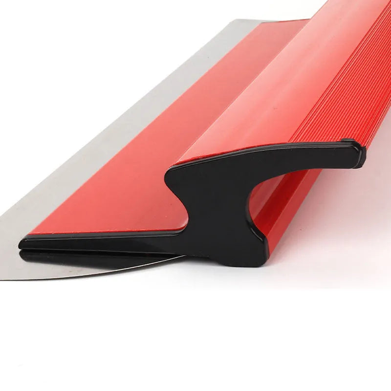 Red leveling scraper tool with a 40cm long blade for wall preparation.