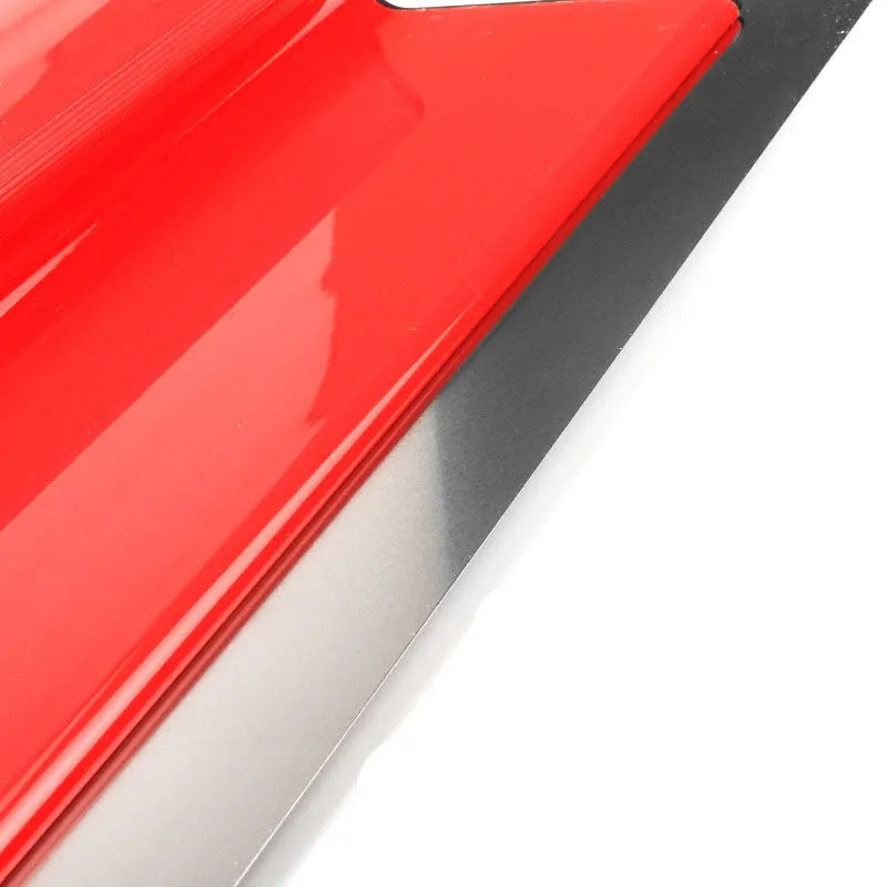 Red leveling scraper tool with a 40cm long blade for wall preparation.