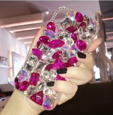 Clear TPU iPhone case with luxury crystal rhinestone decoration on back, compatible with multiple iPhone models