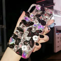 Clear TPU iPhone case with luxury crystal rhinestone decoration on back, compatible with multiple iPhone models