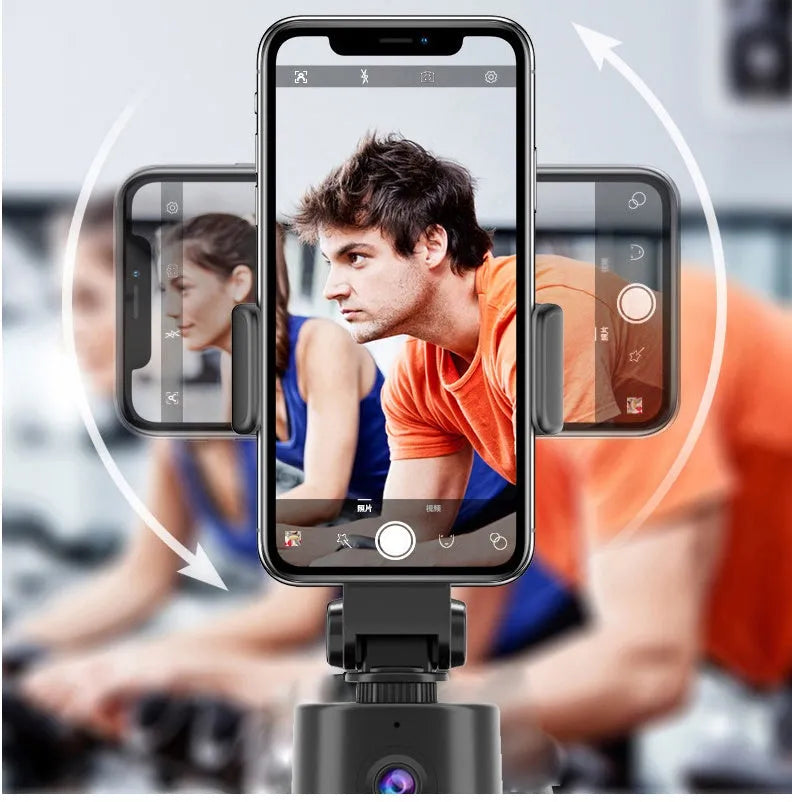 360 degree AI tracking pan tilt smartphone bracket on a table, showing phone holder and rotation base.