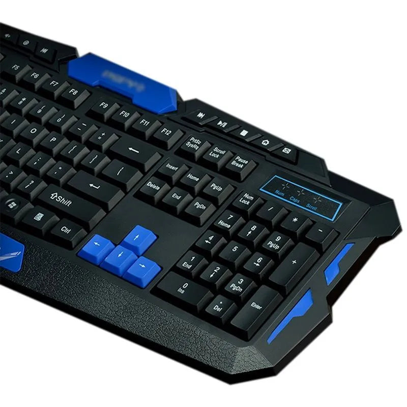 Black wireless keyboard and mouse set with blue accents on a desk