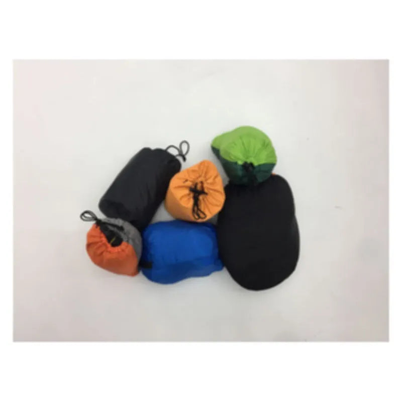 Automatic quick-opening double hammock with mosquito net and sun shades in Army Green Orange set up between trees outdoors