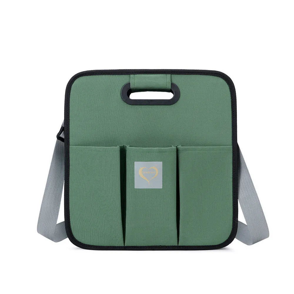 Portable shoulder baby nappy messenger bag with foldable cot, sunshade cloth, mosquito net, and soft mattress in green