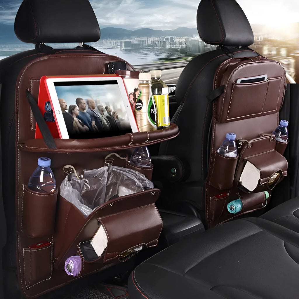 Black PU leather car seat back organiser with multiple pockets hanging on a car headrest.