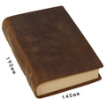 Brown handmade cowhide leather notebook with 200 pages, 19x14cm paper size, lying open on a wooden desk