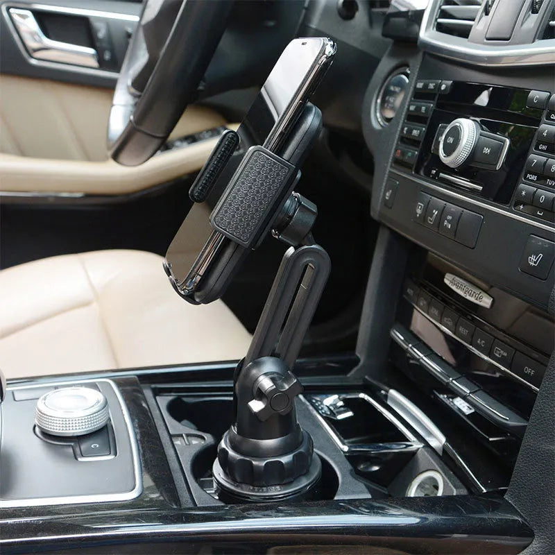 Black ABS car phone holder mounted on a car air vent, showing 360-degree rotation.