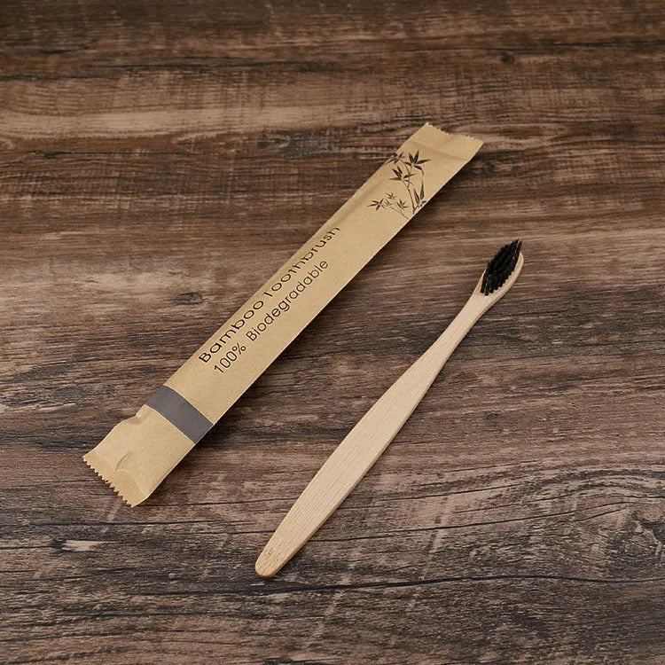 10 multi-coloured natural bamboo toothbrushes with soft charcoal bristles arranged on a white background