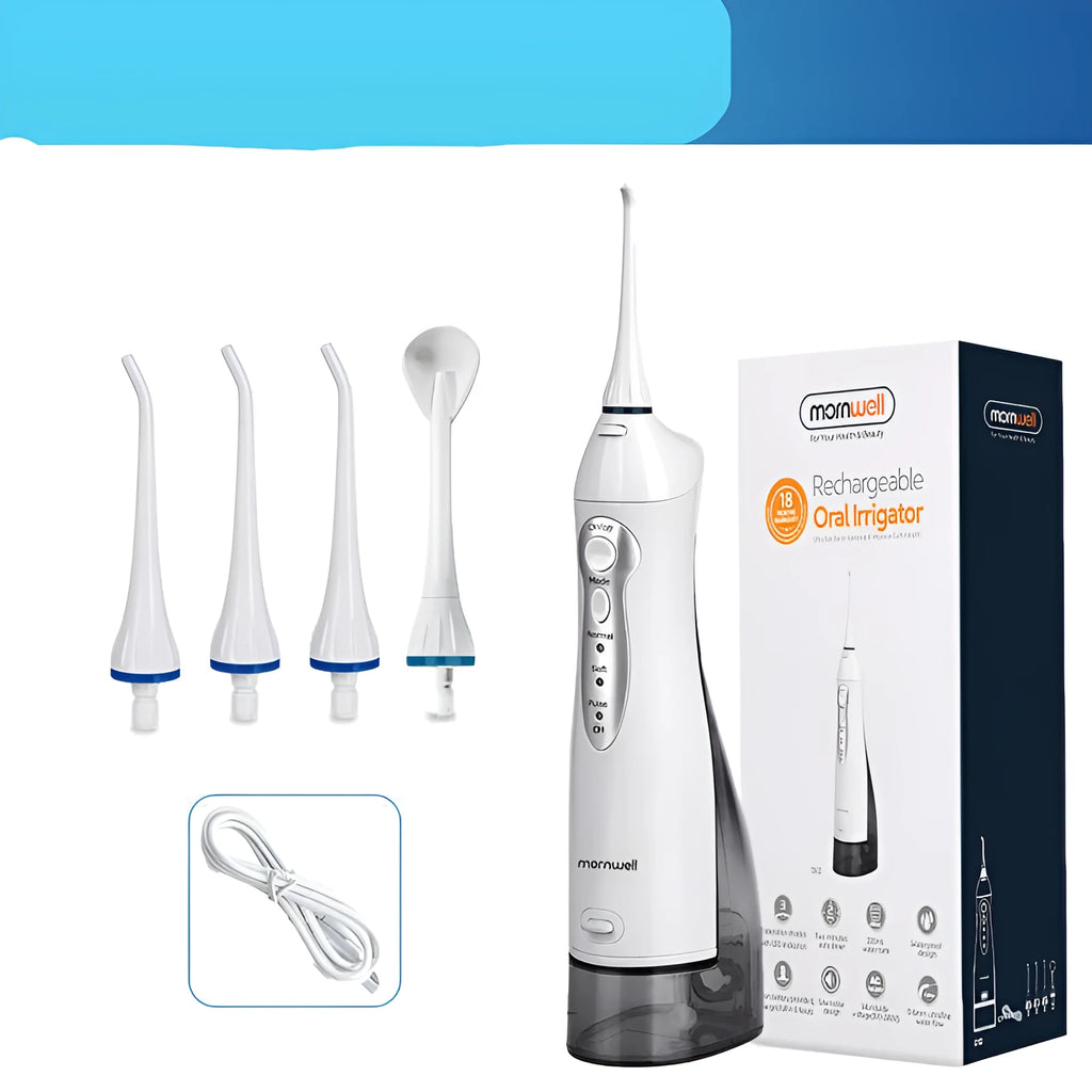 Portable white oral irrigator water flosser with large water tank and four coloured nozzles on a bathroom counter.