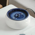 Ceramic cat automatic drinking fountain in starry sky blue with water circulation, white water pump, and USB plug option