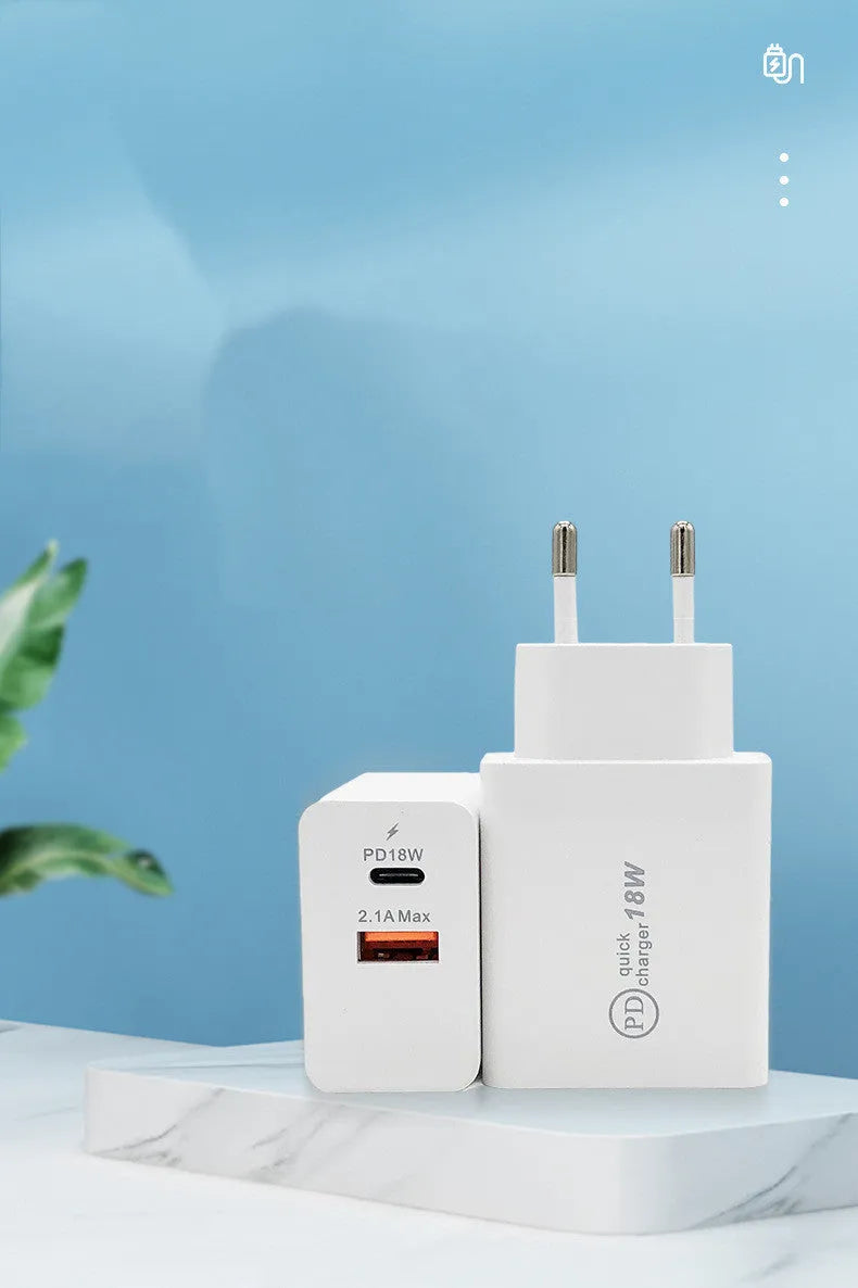Black 18W USB-C fast wall charger with bare metal US plug pins on white background.