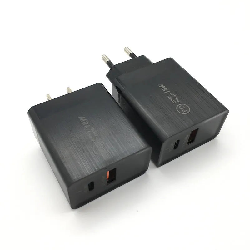 Black 18W USB-C fast wall charger with bare metal US plug pins on white background.