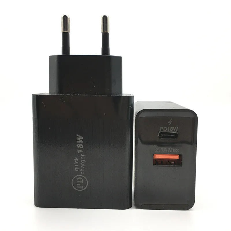 Black 18W USB-C fast wall charger with bare metal US plug pins on white background.