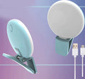 Compact clip-on LED fill light for mobile phone selfies and video, shown in blue.