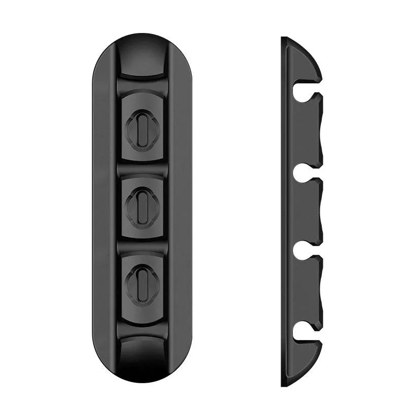 Black soft plastic desktop magnetic cable organiser and charging base stand.