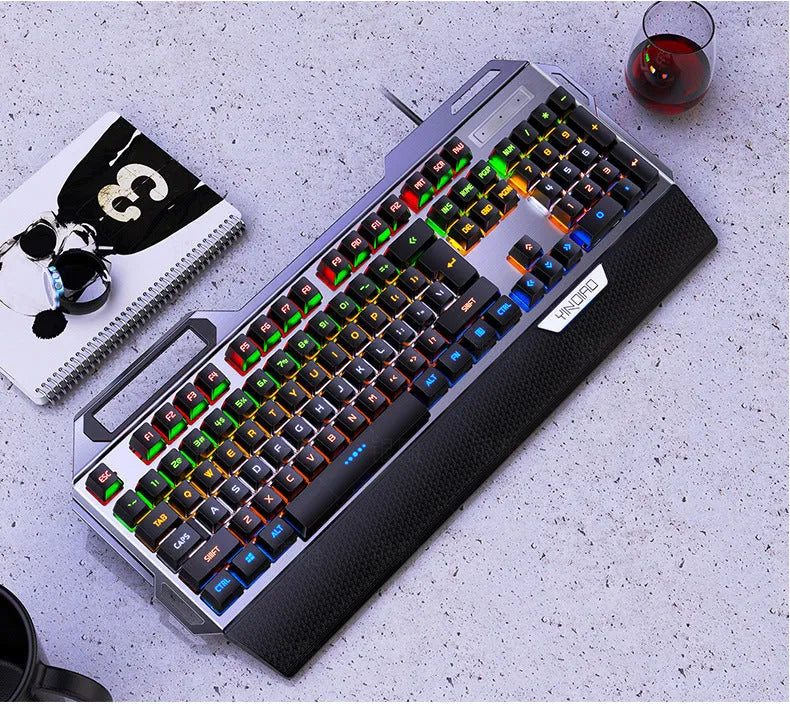 Silver Carving K100 black mechanical keyboard with hand rest and phone holder on desk