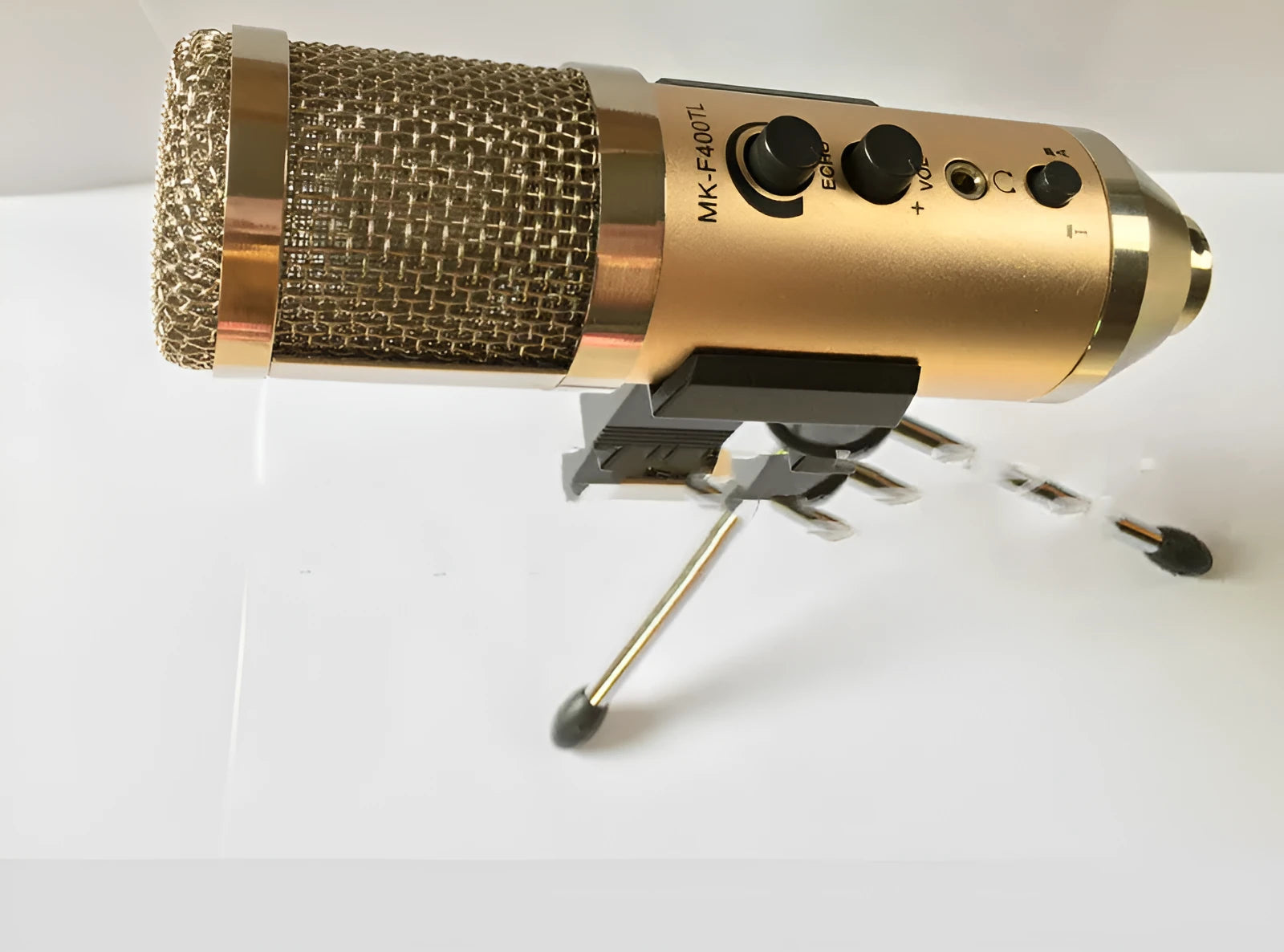 Gold condenser microphone on included bracket for wireless use with phones and computers.