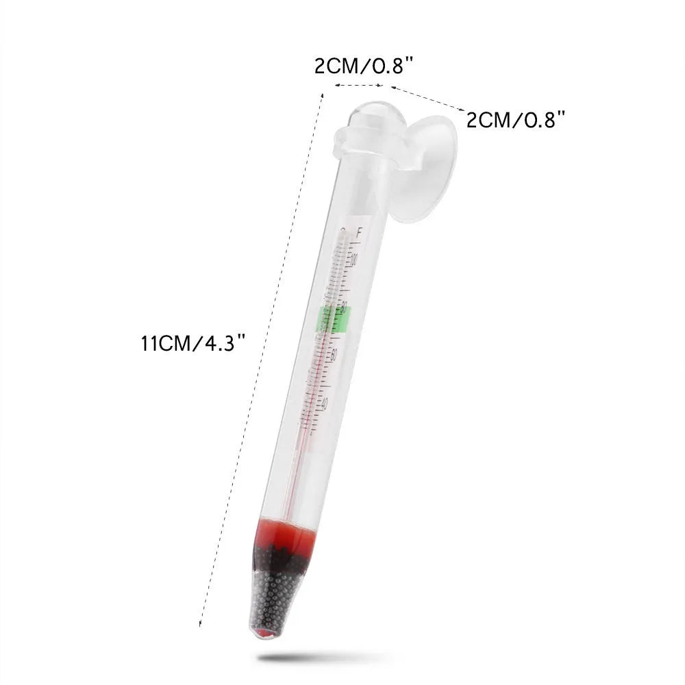 White glass aquarium fat thermometer with suction cup floating on water surface showing temperature scale
