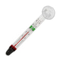 White glass aquarium fat thermometer with suction cup floating on water surface showing temperature scale