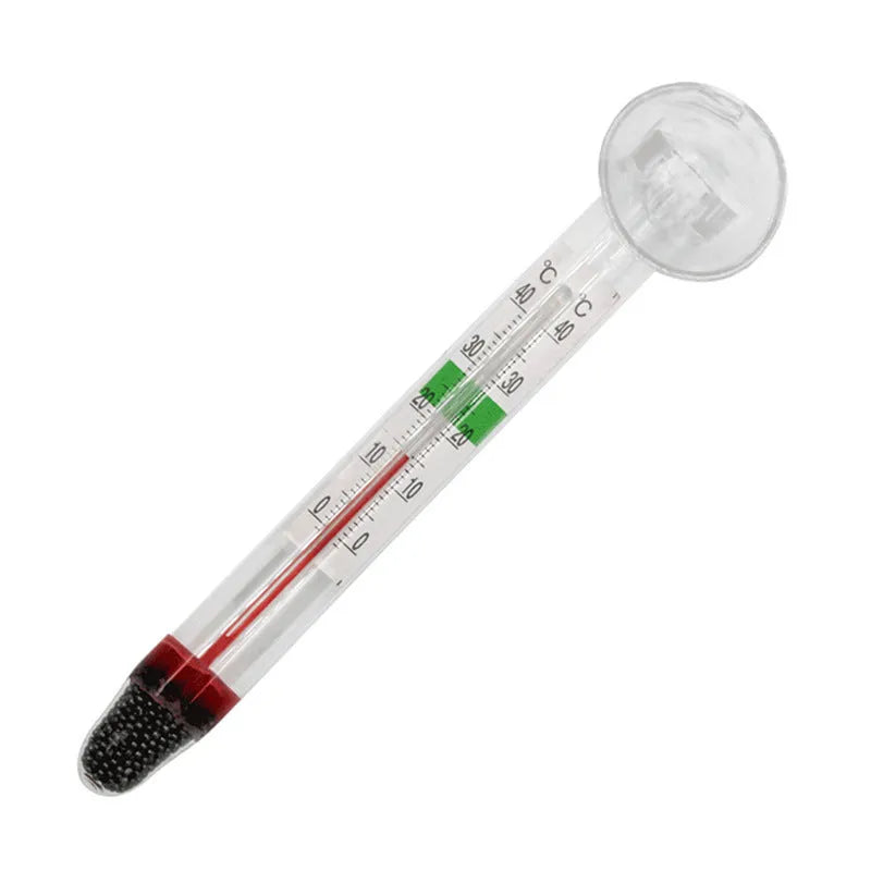 White glass aquarium fat thermometer with suction cup floating on water surface showing temperature scale