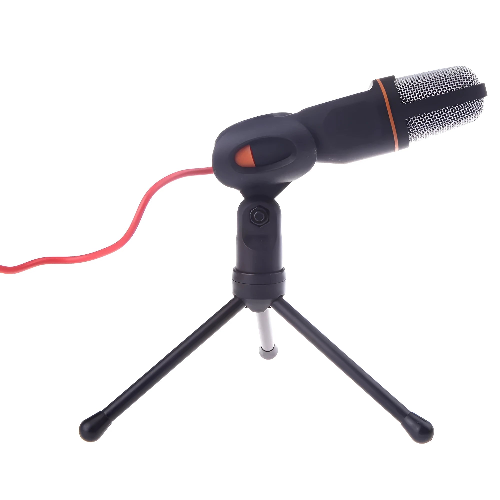 Black wired microphone with adjustable holder clip on a desk next to a laptop.