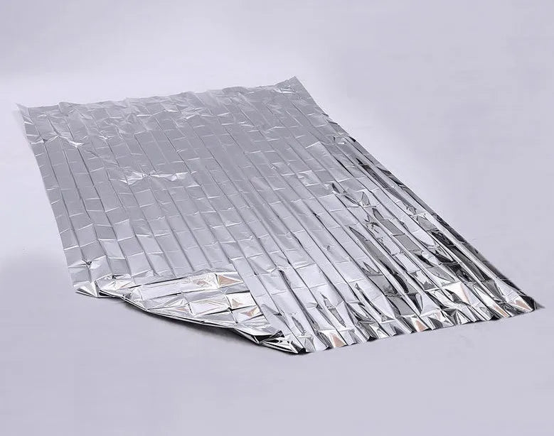 Gold silver emergency blanket made from PET film with reflective coating, 130x210cm size, for outdoor survival and rescue.