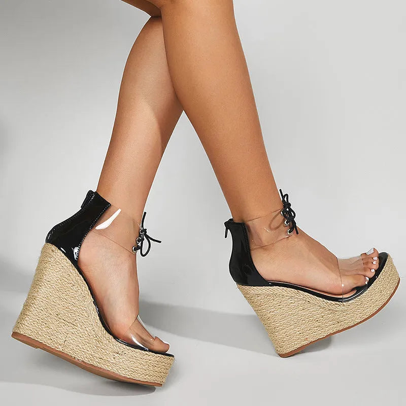 Black women's wedge sandals with hemp rope detail and a super high platform heel.