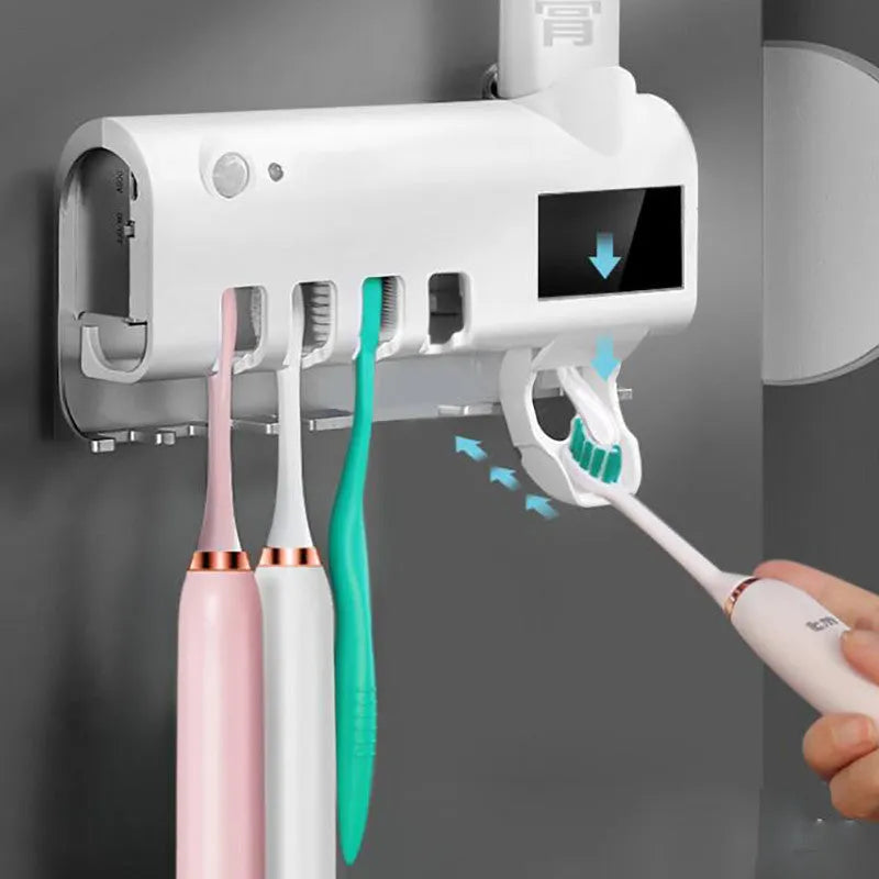 Wall-mounted UV toothbrush steriliser with automatic toothpaste squeezer in black or white colour