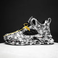 Men's high-top camouflage basketball shoes in black, green, red, and white colours.