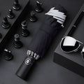Automatic reverse folding umbrella with reflective cloth in black colour, showing folded length.