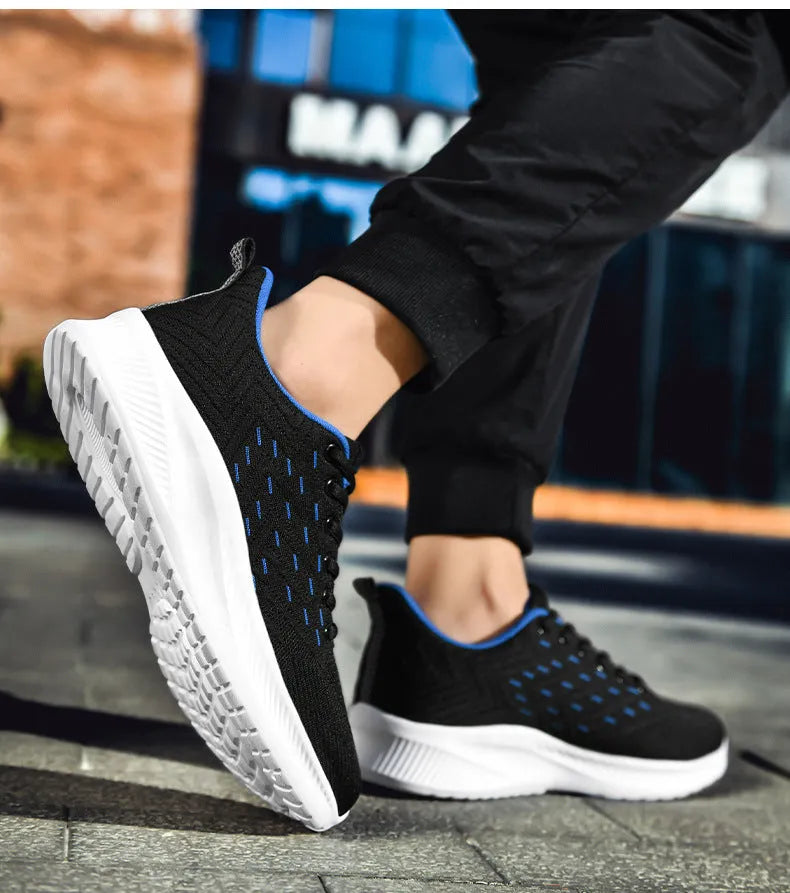 Men's breathable lightweight running shoes in grey with woven fabric upper and cross-strap design