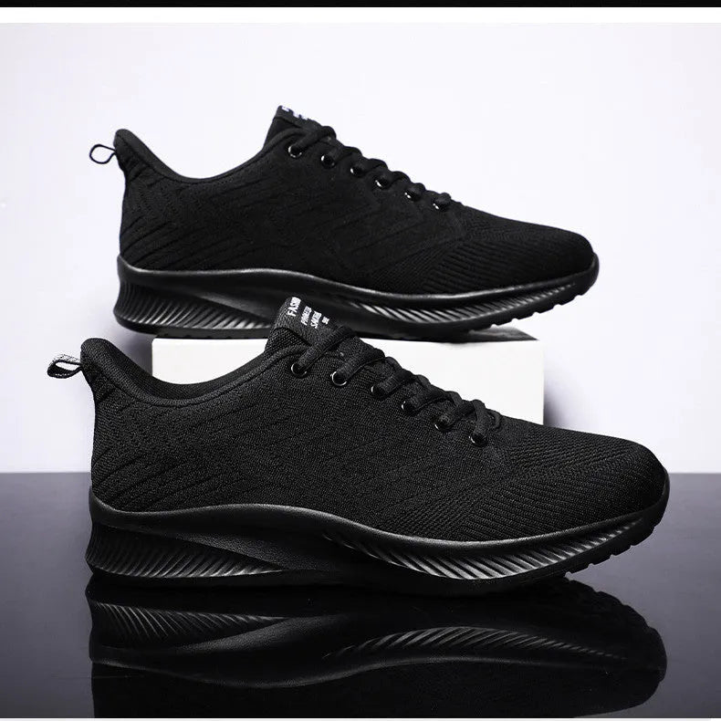 Men's breathable lightweight running shoes in grey with woven fabric upper and cross-strap design